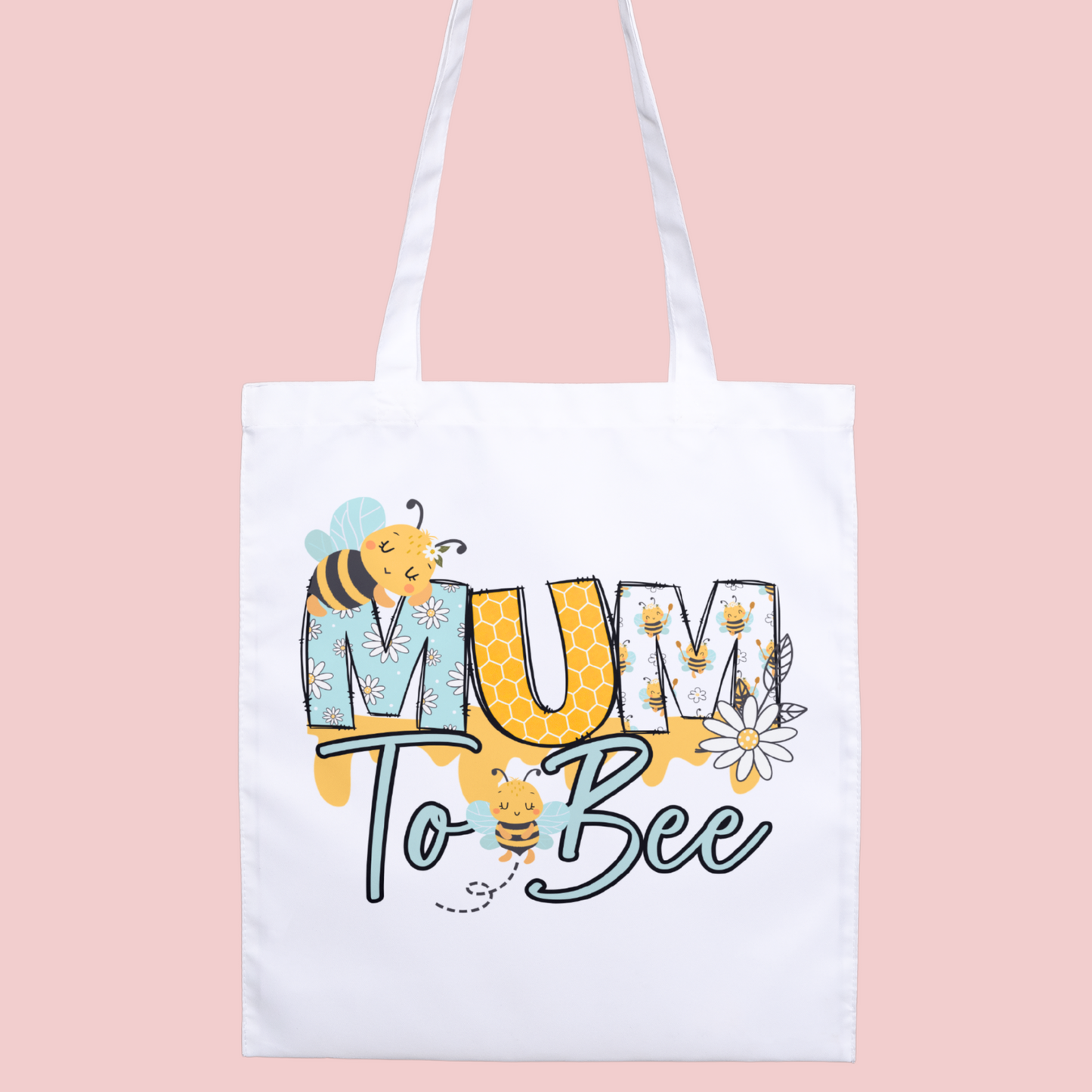 Premium tote bag with a cute cartoon bee illustration and the phrase ‘Mum to Bee,’ celebrating expecting mums with a fun, playful design.