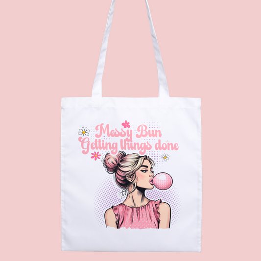 Cute pop art girl with messy bun ‘Getting Things Done’ tote bag, perfect for busy women and self-care.