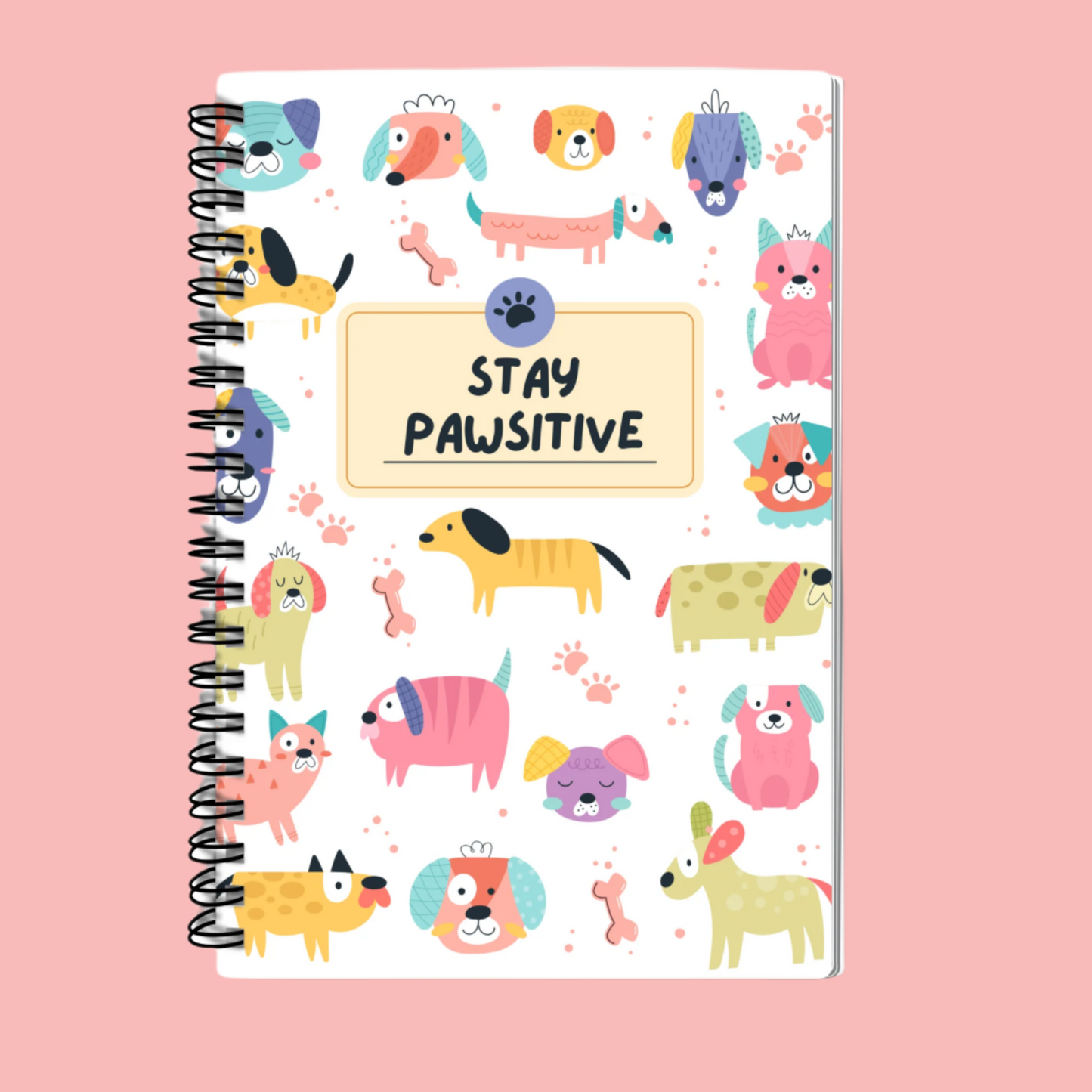 A5 Stay Pawsitive Dog Print Notebook with cute, playful design, spiral bound, featuring 100 lined pages for journaling, note-taking, and doodling. Perfect for dog lovers and pet enthusiasts.