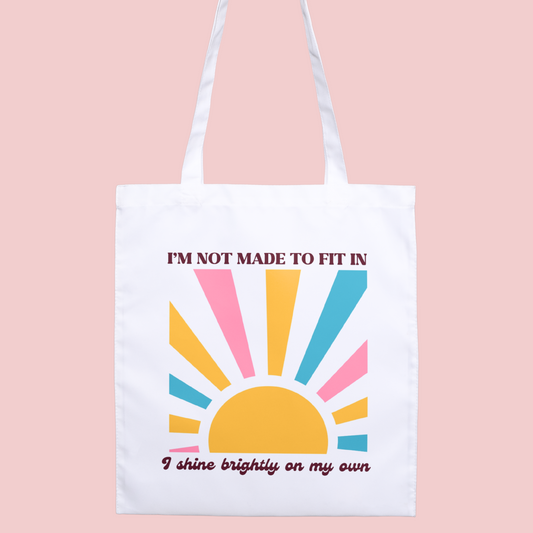 Colourful boho sunshine ‘I’m Not Made to Fit In’ tote bag, perfect for neurodivergent individuals celebrating their uniqueness.