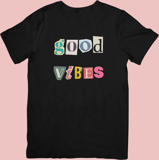 Vintage scrapbook-style colourful crew neck t-shirt with the phrase ‘Good Vibes,’ spreading positivity and retro vibes.