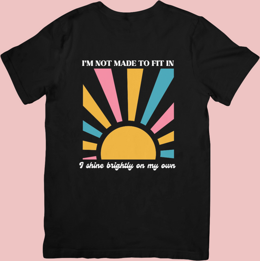 I’m Not Born to Fit In crew neck t-shirt with a retro sunset design, colourful typography, and a relaxed unisex fit for a bold, empowering look.