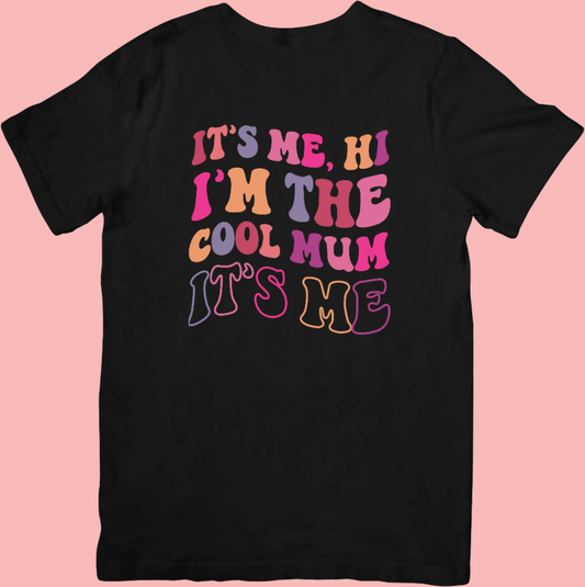 It’s Me, Hi, I’m The Cool Mum crew neck t-shirt with a groovy, colourful retro-style design, soft cotton fabric, and a relaxed unisex fit – perfect for stylish mums.