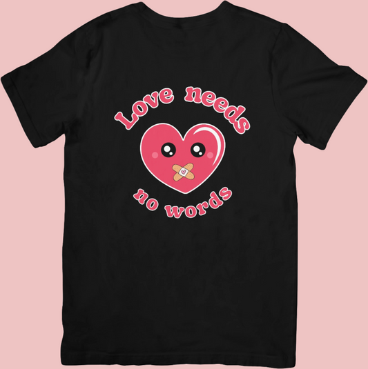 Retro-style crew neck t-shirt with a kawaii heart design and the phrase ‘Love Needs No Words,’ supporting autism awareness and neurodiversity.